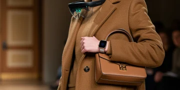 Model showcasing smart accessories for Fall 2026, blending fashion and technology seamlessly.